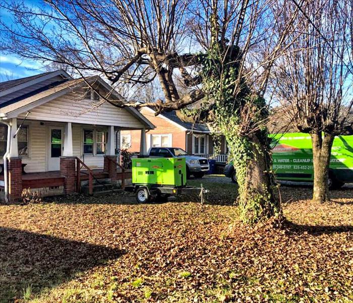 SERVPRO responding to a residential storm damage incident in Forest City