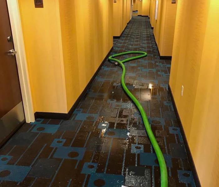 Hotel floor water damaged through the hallway
