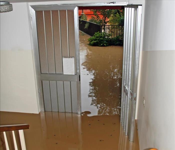 entrance of a House fully flooded during the flooding of the river